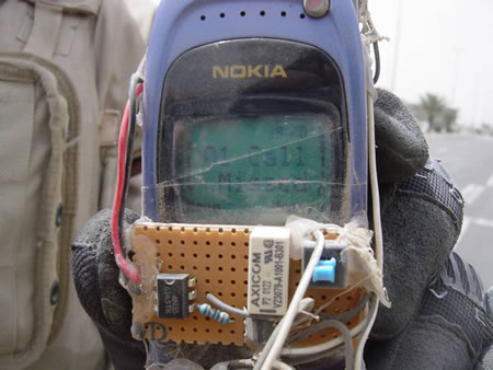 Photo of cell phone modified for use as a bomb trigger, recovered by Allied bomb squad operating somewhere in the Middle East